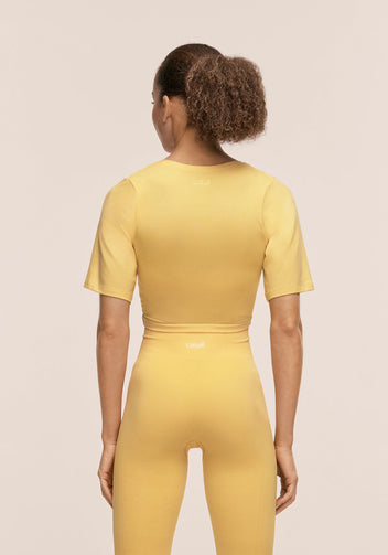 Casall Delight Cropped Wrap top yoga giallo leggero
